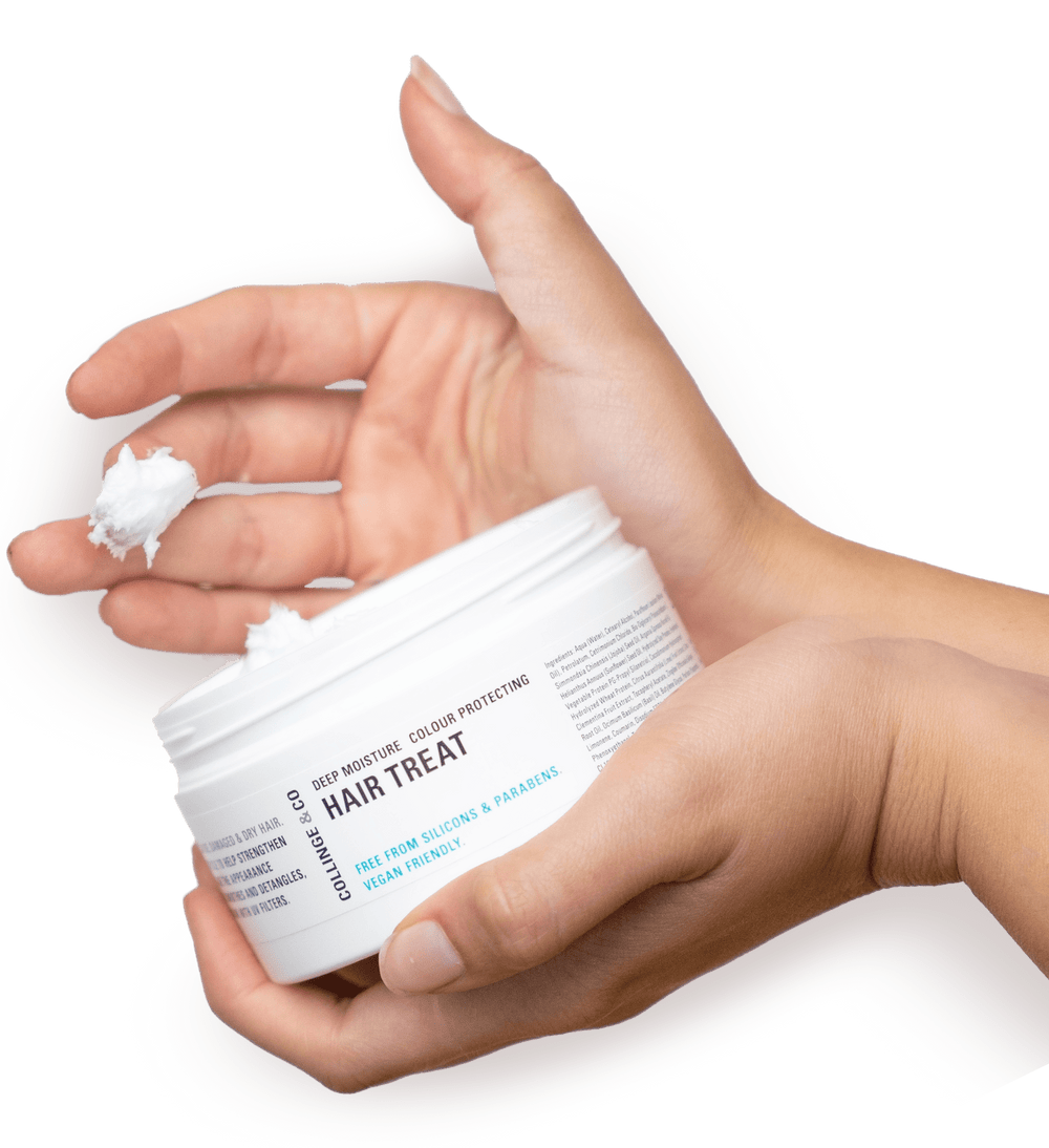 Hair Treat product in someones hand