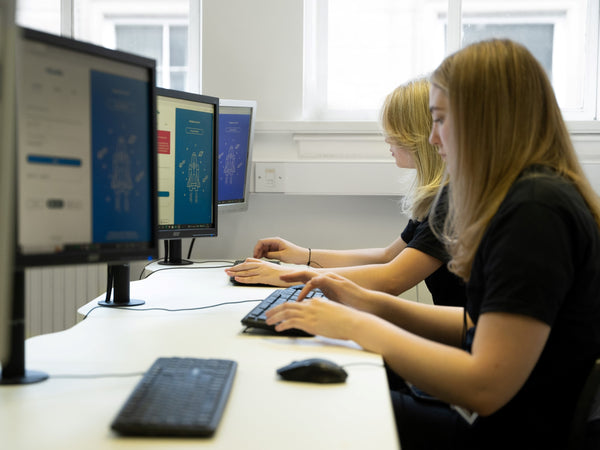 Collinge & Co Training apprentices working at computer